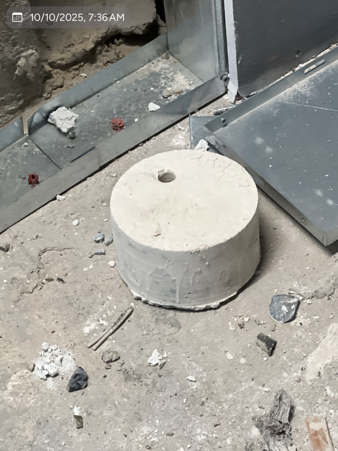 Finished cylindrical concrete core removed from a commercial floor