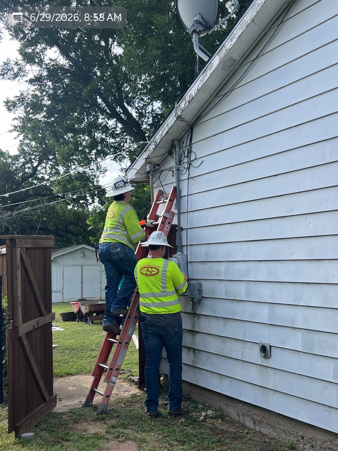 Electrical service work underway at a residential property