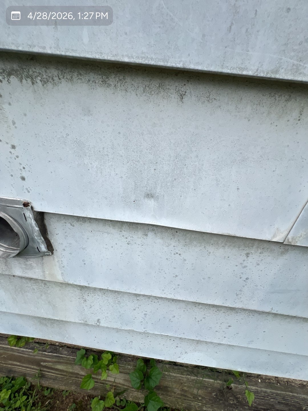 Hail impact dents across aluminum siding